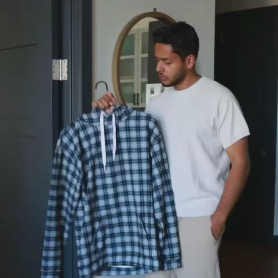 Man dressing up in a complete black and white plaid outfit jogger with hoodie