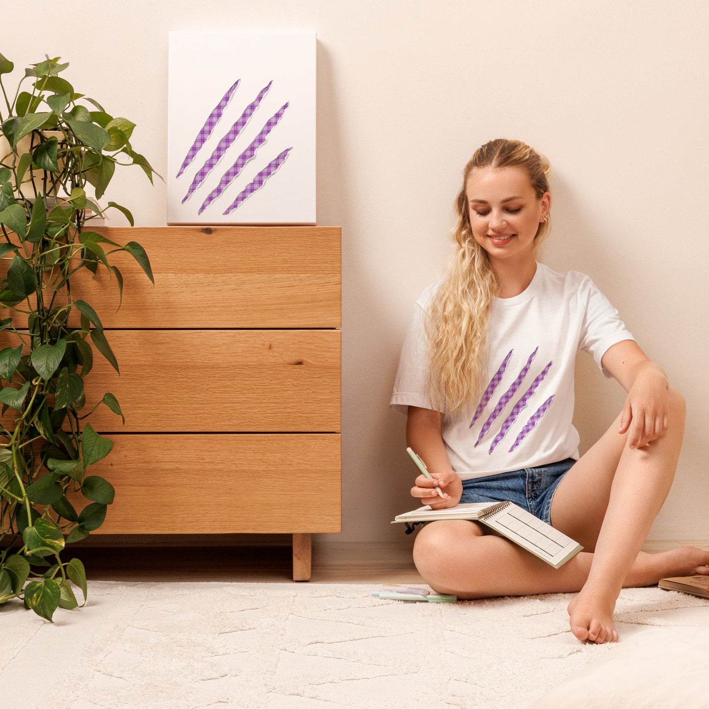 White t-shirt with Purple Pop claw marks